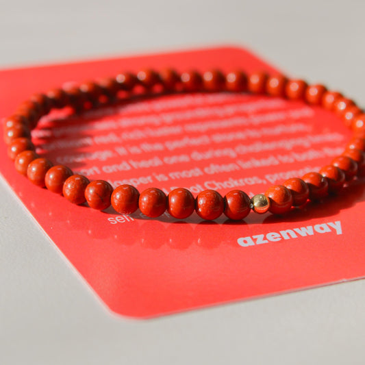 Red Jasper Bracelet on red Azenway meaning card — natural 4mm stones with gold-filled accent