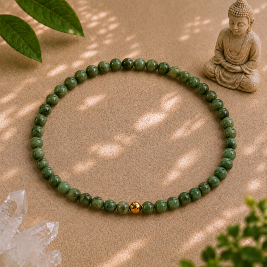 African jade crystal bracelet with 4mm green gemstone beads and a single 14k gold-filled accent bead on a warm zen backdrop.