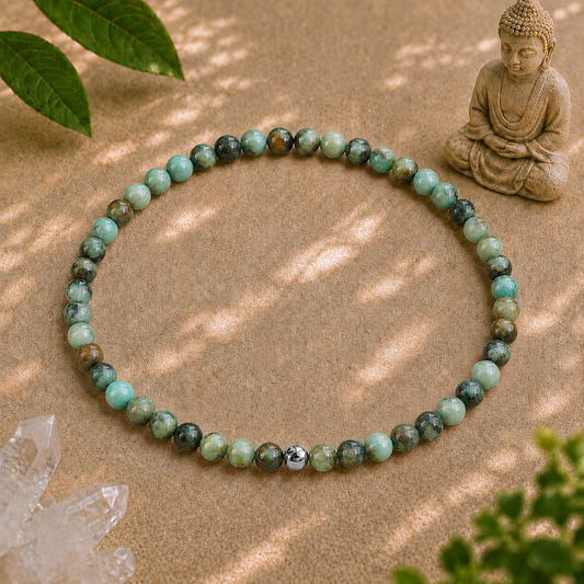 African turquoise crystal bracelet with 4mm marbled gemstone beads and a single 925 sterling silver accent bead on a warm neutral zen backdrop.