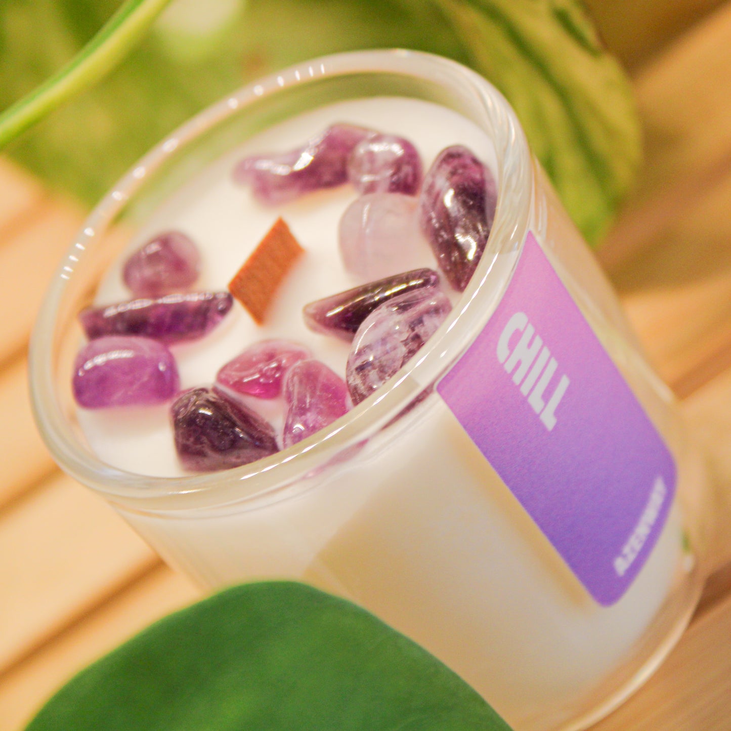 Mini amethyst crystal candle with wooden wick and essential oil blend in glass jar