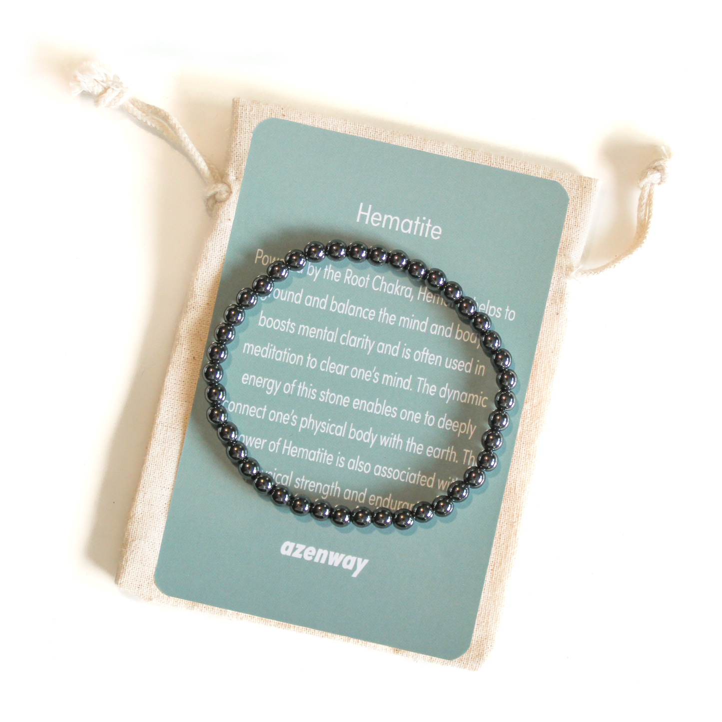 Hematite gemstone bracelet displayed on Azenway Hematite meaning card and cotton pouch.