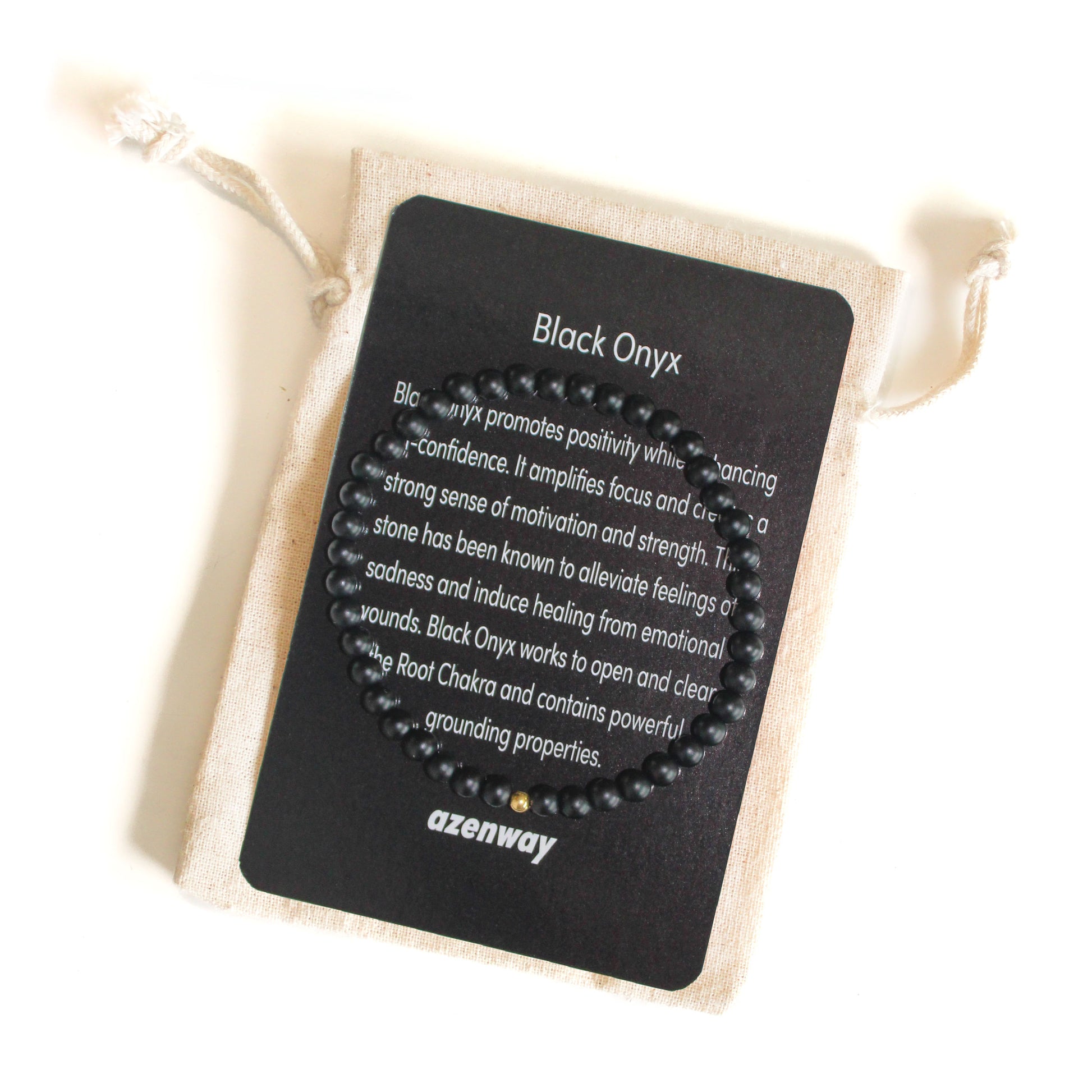 Matte black onyx bead bracelet with a single gold-filled accent displayed on an Azenway crystal meaning card.