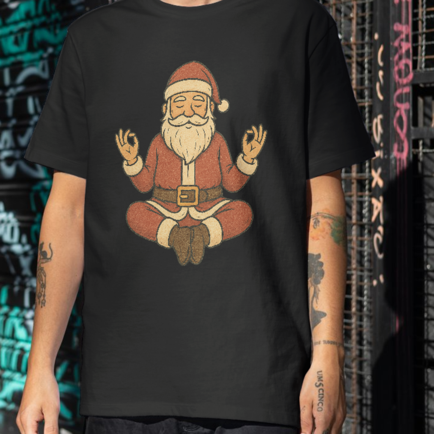 A black t-shirt with a grainy retro illustration of Santa sitting cross-legged in meditation, festive yoga shirt.