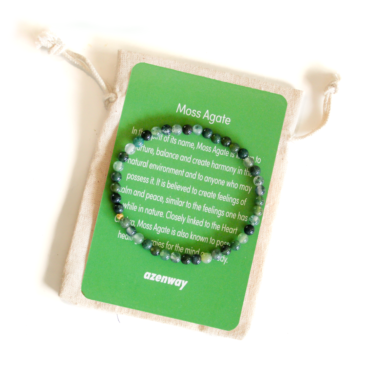 Genuine Moss Agate gemstone bracelet with 14k gold-filled accent displayed on the Azenway meaning card and cotton gift bag.