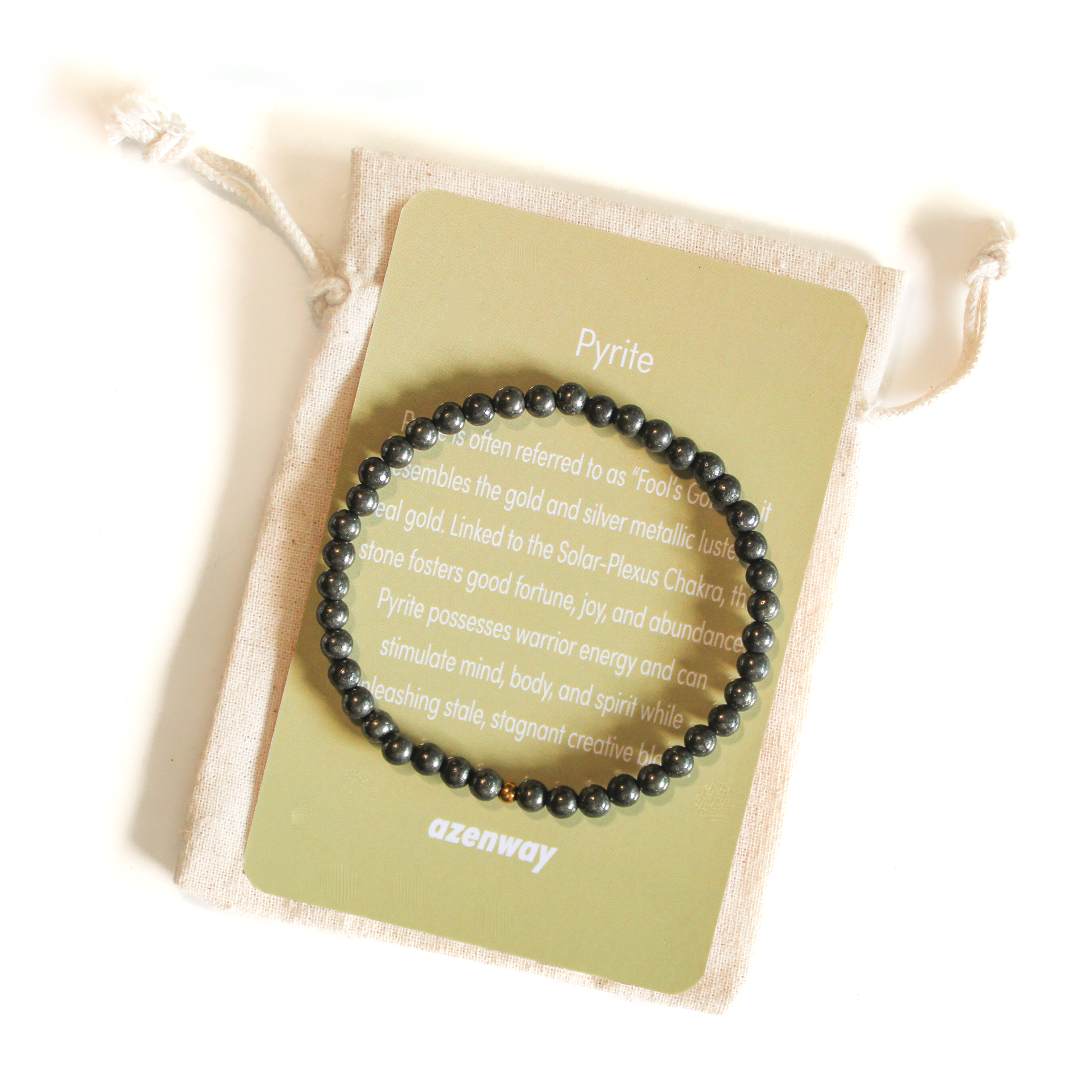A Pyrite gemstone bracelet displayed on an Azenway Pyrite meaning card and drawstring pouch.