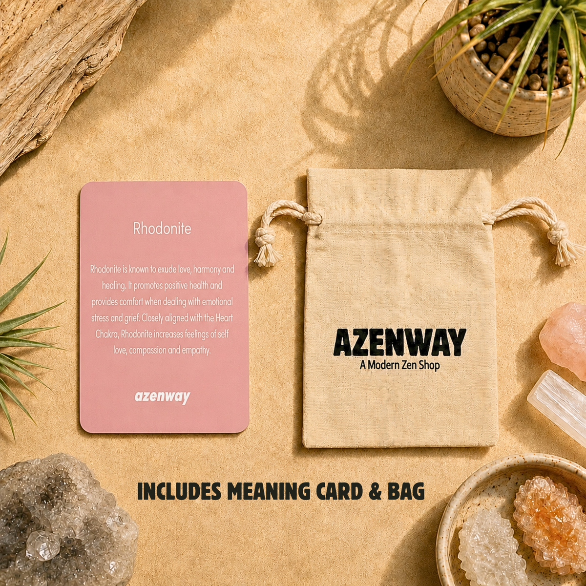 Rhodonite meaning card and Azenway drawstring bag displayed on a warm, zen-inspired background with crystals and greenery. Text reads “Includes Meaning Card & Bag.”