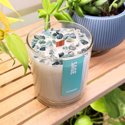 Detailed view of green crystal chips and wooden wick on top of sage aromatherapy candle