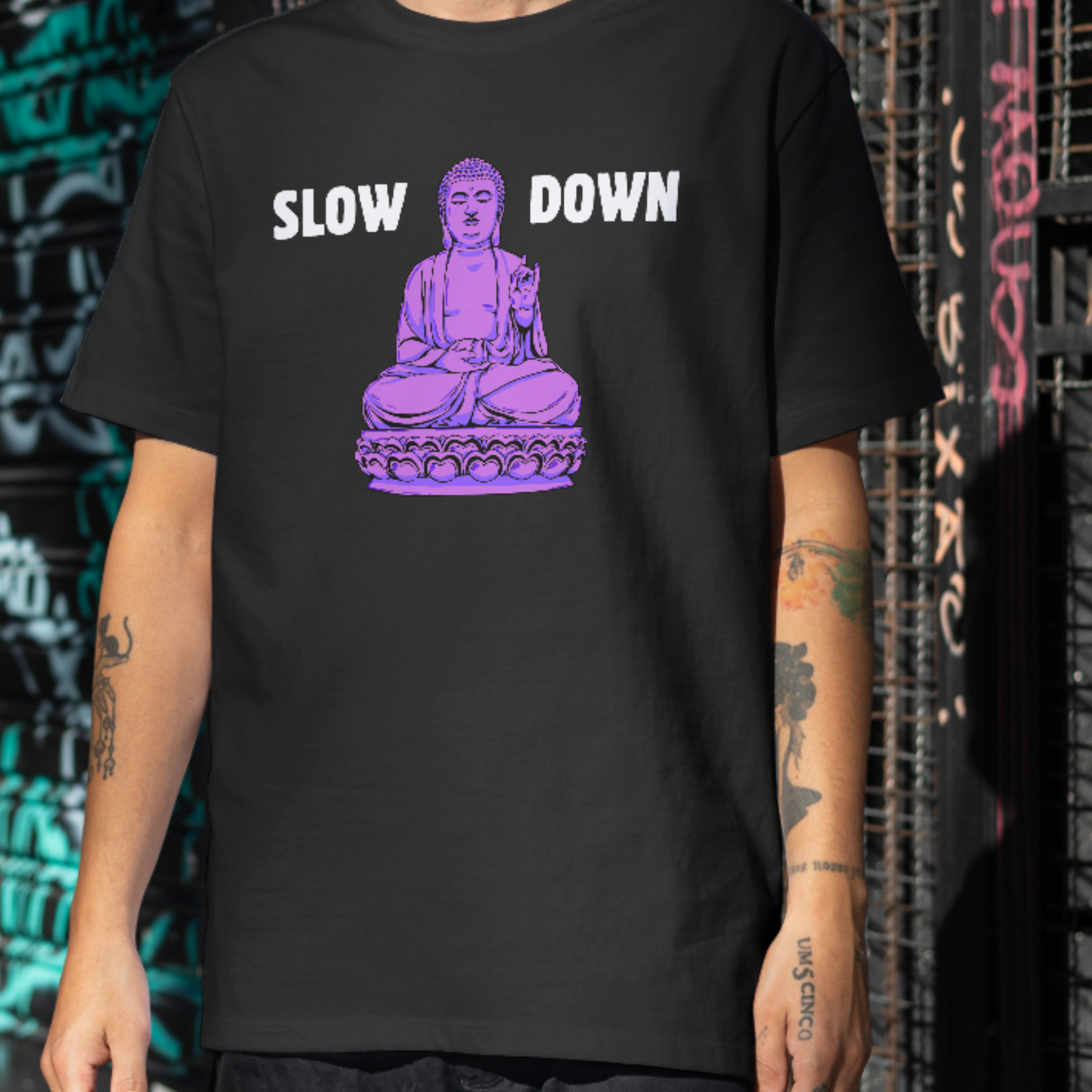 Black t-shirt with purple meditating Buddha graphic and text Slow Down — Azenway mindfulness apparel.