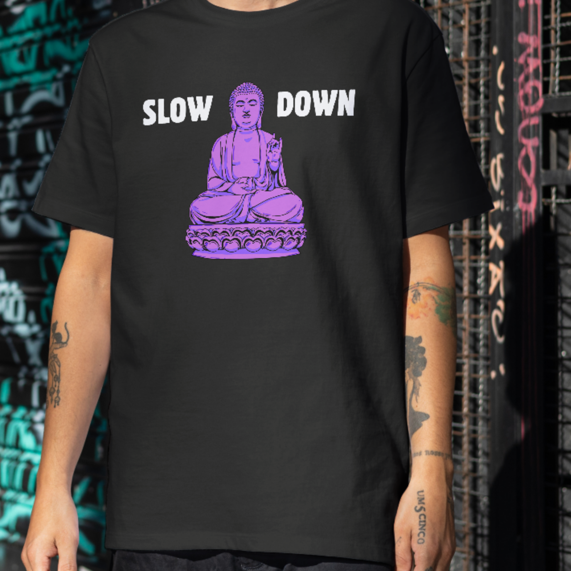 Black t-shirt with purple meditating Buddha graphic and text Slow Down — Azenway mindfulness apparel.