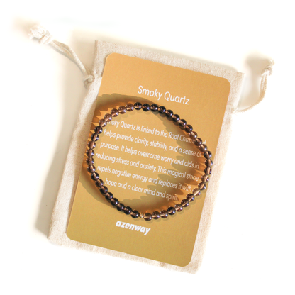 Smoky Quartz 4mm crystal bracelet with gold-filled accent displayed on its tan Azenway meaning card.