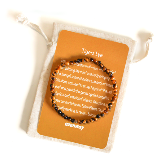 Tiger’s Eye gemstone bracelet displayed on an Azenway meaning card and cotton gift bag.