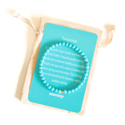 Turquoise gemstone bracelet displayed on an Azenway meaning card and cotton pouch, featuring 4mm beads with a gold-filled accent.