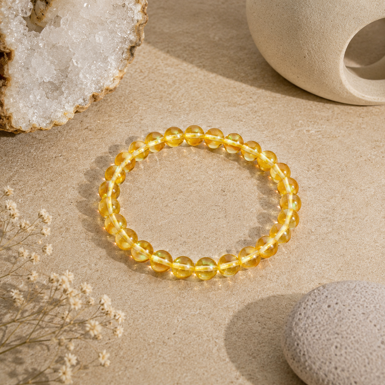 Handmade Yellow Mystic Glass stretch bracelet featuring premium 6mm iridescent glass beads on a warm neutral stone surface with natural crystals and zen-inspired décor. Lightweight bracelet shimmers with vibrant golden-yellow tones and luminous reflections.
